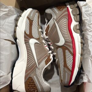 Nike Tan and Red Athletic Shoes with Breathable Mesh and Swoosh